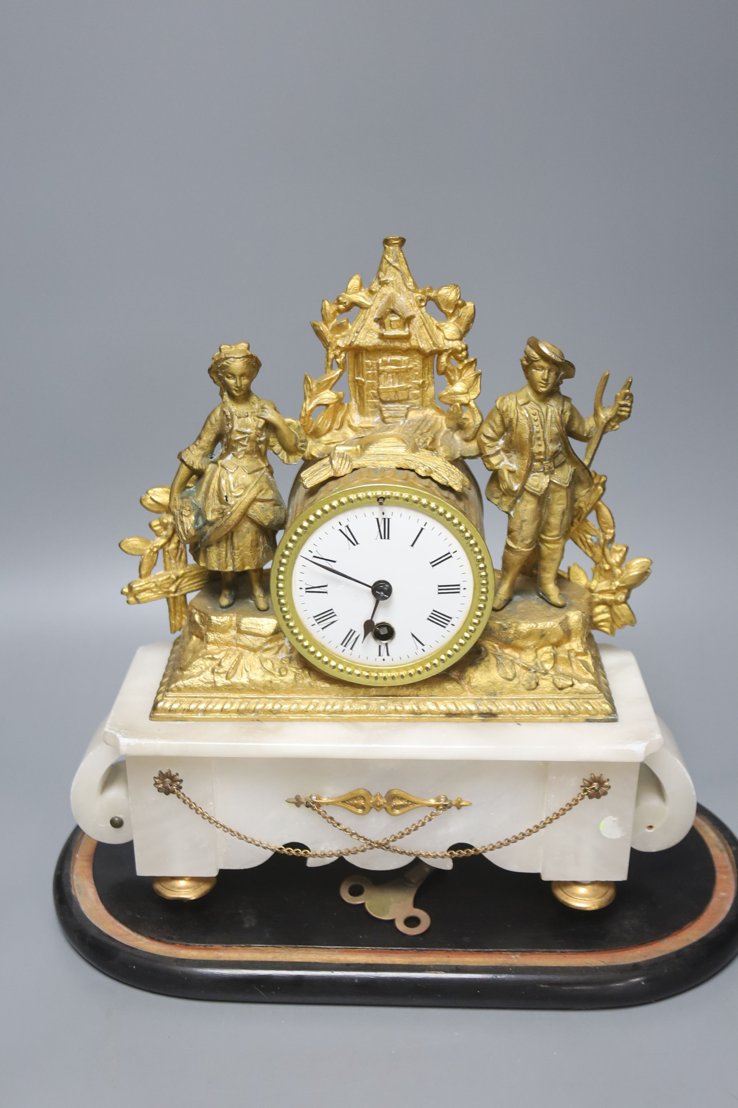 A French gilt metal and alabaster mantel clock, under dome, overall height 40cm